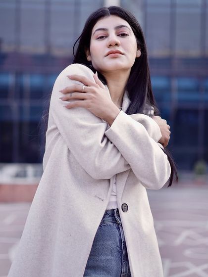 A soft, introspective pose that adds emotional depth to a fashion portfolio.