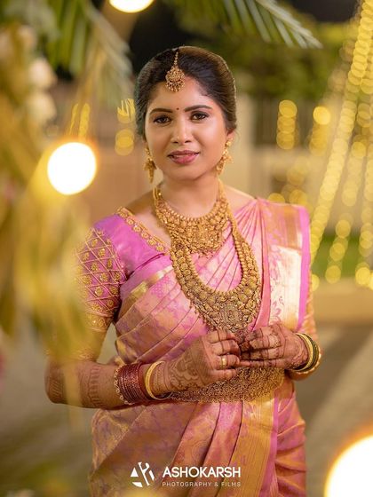 Another stunning portrait of the bride, her regal look completed by the intricate henna on her hands.