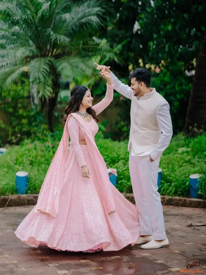 A playful, dancing pose with Cheryl and Edwin in a beautiful garden setting. This captures the fun and joyful side of their relationship during their engagement shoot.