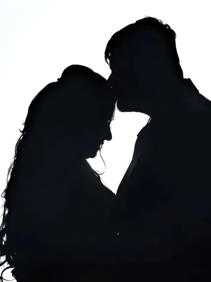 An artistic silhouette portrait that focuses on the couple's connection. This style of creative wedding photography creates timeless and dramatic images you will cherish forever.