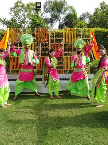 Our Bhangra troupe in vibrant costumes, ready to perform at an outdoor Mehendi or Haldi function.