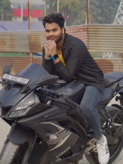 A relaxed, leaning pose on the motorcycle. This shot has a casual and confident vibe, great for a lifestyle portfolio.