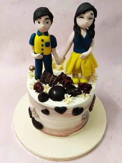 Another view of the anniversary cake, surrounded by decadent chocolate details for a truly sweet celebration.