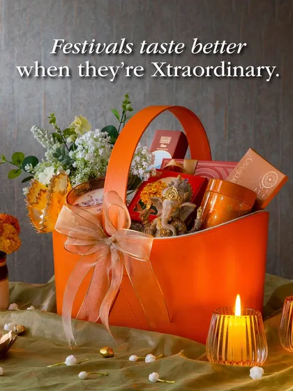 Festivals taste better when they're Xtraordinary. This vibrant orange hamper is packed with treats, flowers, and a Ganesha idol, making it a complete festive package.