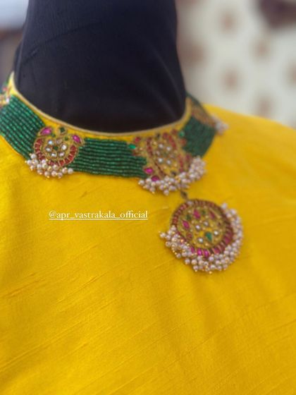 A blouse designed with a choker-style neckline that mimics the look of a necklace, showing another way I create built-in accessories.