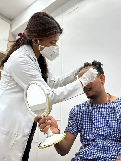 The consultation is a crucial step. I spend dedicated time with each patient, like this one, to finalize the hairline design, ensuring it is artistically drawn to suit their face shape and expectations.