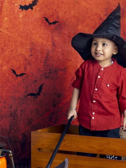 This little wizard is exploring the spooky forest in our fun Halloween setup.