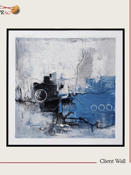 A textured abstract in blue, white, and black, selected to add a modern artistic touch to a client's workspace.