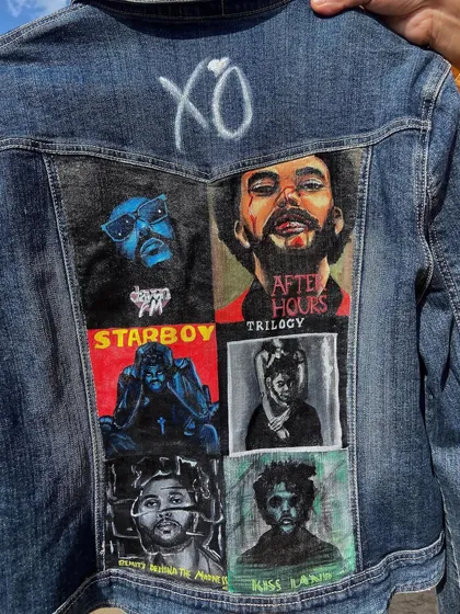 Another look at the custom 'XO' fan jacket. This angle highlights the composition of the six painted album portraits on the back of the classic blue denim.