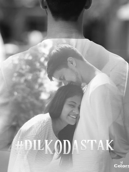 An artistic black and white edit with a double exposure effect and the hashtag #DilKoDastak.