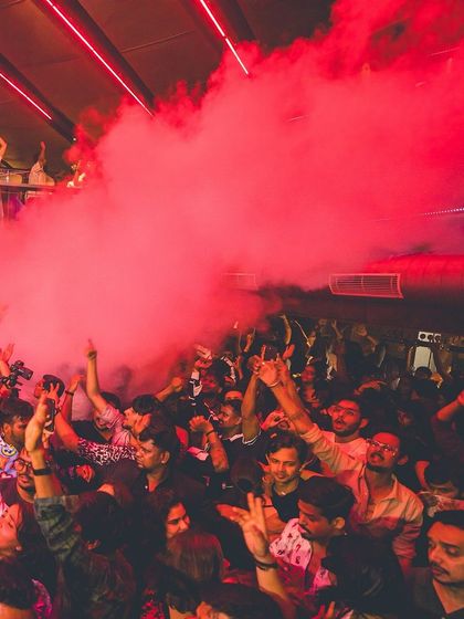 A red smoke cannon fires over the crowd at Flo. The use of CO2 jets adds a dramatic, high-impact element to my sets.