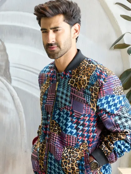 A full shot of the multi-patterned jacket, crafted from a premium polyester blend. This piece is a must-have for any fashion-forward wardrobe.