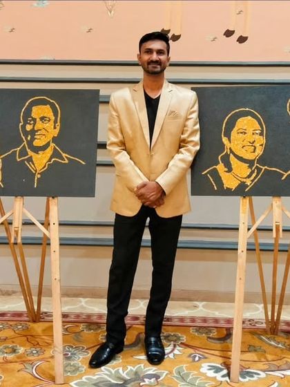 Standing proudly with the two completed glitter portraits. Each one was created as a surprise for the respective couples to celebrate their 25 years together, a memory they can now keep forever.