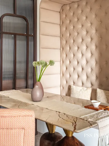 I love creating unique, intimate corners. This cozy dining nook with its plush, tufted banquette seating and marble-topped table is a perfect example of how to blend comfort with high-end design for everyday luxury.
