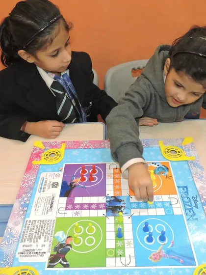 Two students enjoy a game of Ludo during our Device Detox Day. We believe in the power of traditional games to teach strategy, patience, and sportsmanship.