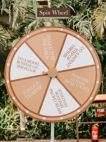 Interactive games are a great way to break the ice. This custom 'Spin the Wheel' game at a Haldi function had guests performing fun dares and challenges.