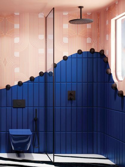 This bathroom is a bold statement, with wavy blue tiles meeting a patterned pink wall. The black spherical details add a graphic, playful touch.