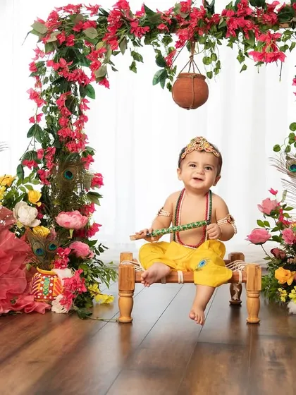 A full view of our beautiful Janmashtami setup, with a floral arch and a tiny swing for our little Krishna. I love creating elaborate sets for special occasions.