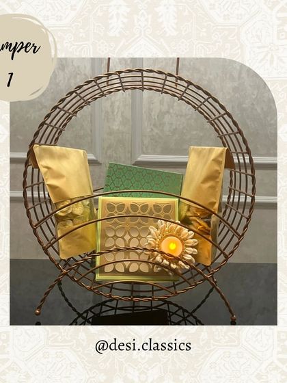 This is our Hamper 1 for Diwali, featuring a beautiful wire basket, assorted snacks, a mithai box, and a decorative diya to light up your festivities.