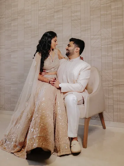 A classic, elegant portrait that showcases the couple's beautiful attire and their easy chemistry. This was taken during their engagement ceremony, a perfect start to their wedding album.