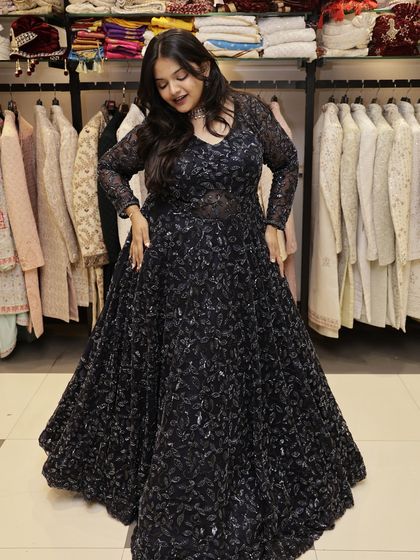 This shot shows the beautiful flare of the navy blue gown. It’s designed to be comfortable while making a statement, perfect for a night of dancing at a sangeet or reception.