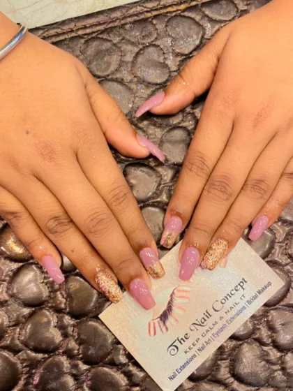 A beautiful combination of mauve and gold on long coffin nails. The design features a gold glitter ombre effect on the tips for a touch of glamour.