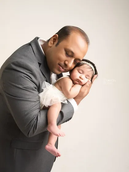 The strength and tenderness of a father's love is a story in itself. In the quiet of the studio, we create space for these powerful bonds to be felt and captured, creating a cherished memory of how small they once were in your hands.