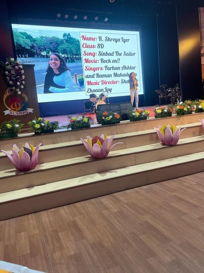 A student performs on stage at the Music Mania competition. We encourage our students to participate in such events to gain performance experience.