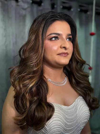 A portrait of the bride, looking sophisticated and elegant for her cocktail event. The makeup is soft yet glamorous.