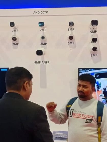 Examining a display of AHD and IP CCTV cameras. I take the time to understand the technical specifications of different models to recommend the perfect fit for your security needs.