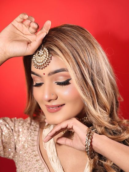 Eyes down, showing the subtle and clean eyeshadow work. The focus is on creating a polished look that isn't overpowering for a day event.