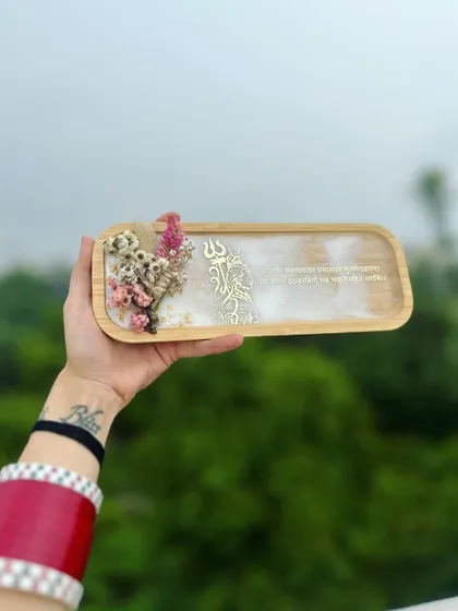 Holding the Mahadev tray against the sky. The natural light brings out the soft, marble-like effect of the white resin.