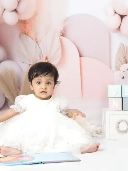 A happy family celebrating their daughter's first birthday. I always encourage parents to jump in for a few shots during milestone sessions.