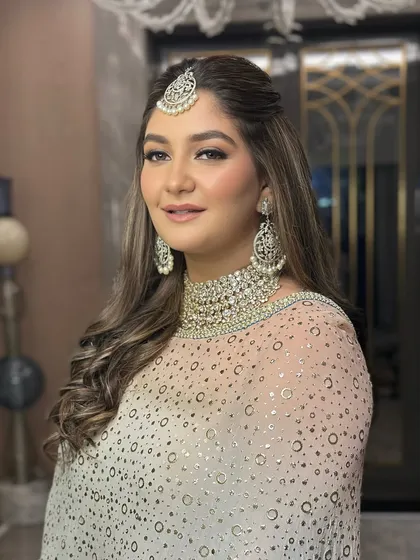 Zaha's engagement look was all about balance. I combined modern touches with a classic finish to create a look that felt timeless, graceful, and uniquely her. A perfect start to her bridal journey.