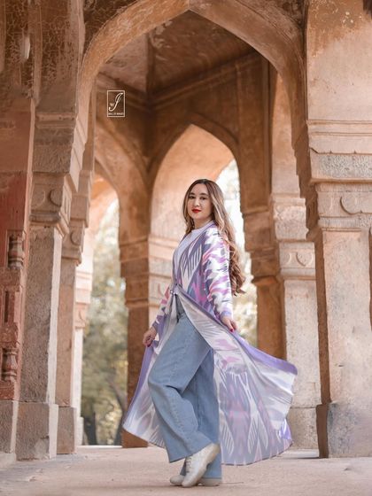 This shot captures the movement of the jacket, adding a dynamic element to the portrait and highlighting the garment's design.