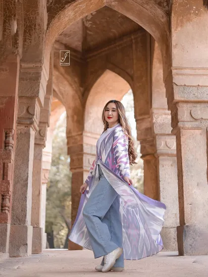 This shot captures the movement of the jacket, adding a dynamic element to the portrait and highlighting the garment's design.