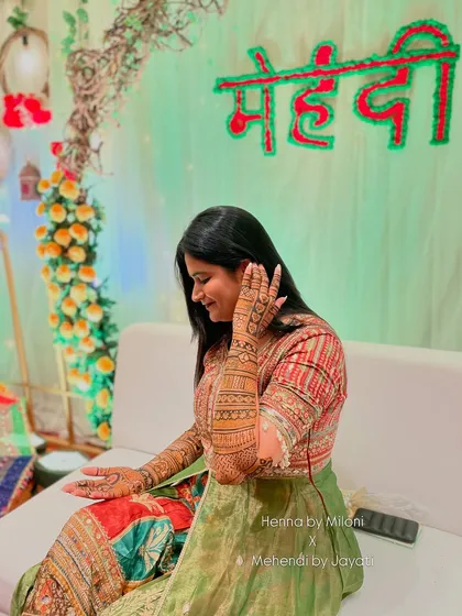 A graceful pose from our Nashik bride, showcasing her stunning henna.