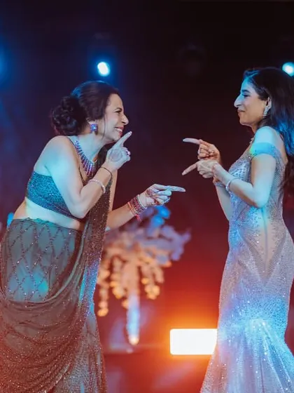 A mother and daughter sharing a cute, interactive moment during their dance. These are the memories that last forever.