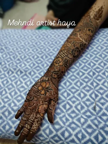 A complete bridal arm design that showcases a variety of techniques. From the detailed finger work to the geometric patterns on the forearm and the floral motifs throughout, this is a true work of art.
