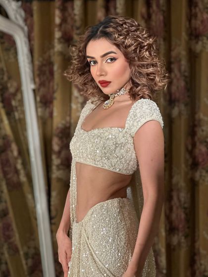 Goddess. Komal Pandey channeling her inner diva with curly hair and a bold red lip. A look that is pure fire.