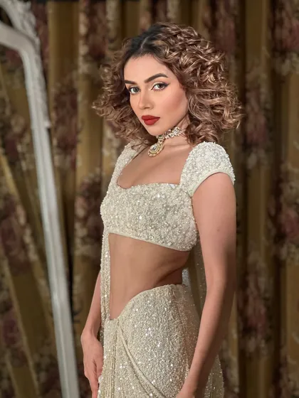 Goddess. Komal Pandey channeling her inner diva with curly hair and a bold red lip. A look that is pure fire.