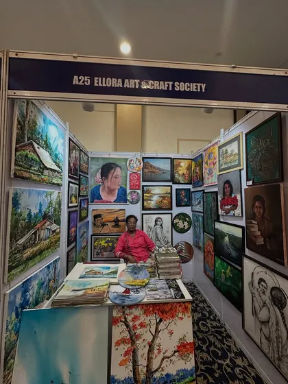 My exhibition booth for the Ellora Art & Craft Society, filled with a variety of my paintings, at the Pune Siddhi Banquet Hall.