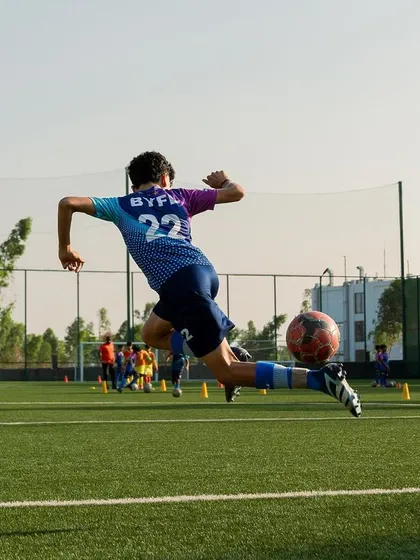 Flying high! This shot captures the power and technique we instill in our players. It's about giving everything in every moment, reaching for that spectacular goal.