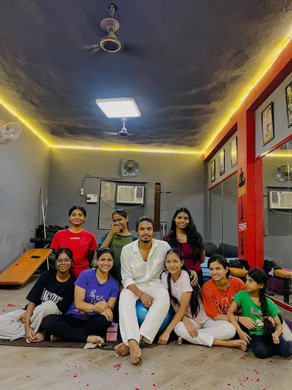 A happy moment with my students on Teacher's Day. The bond we share goes beyond the yoga mat.