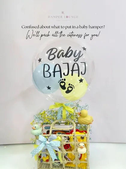 A personalized "Baby Bajaj" balloon takes center stage in this cheerful hamper. The woven basket is filled with rubber ducks and other playful essentials, making it a fun and practical gift.