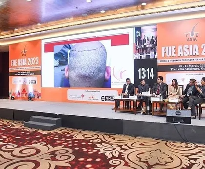 A wide shot of the panel discussion on hair transplant complications. Openly discussing challenges is how we improve standards across the entire industry.