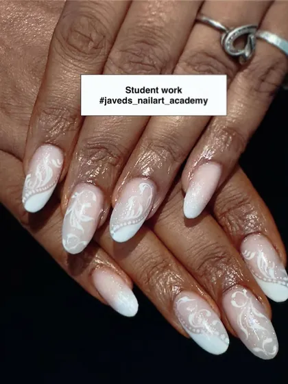 A beautiful example of a student's work. This elegant white-on-nude design with delicate swirls shows a great level of control and precision.