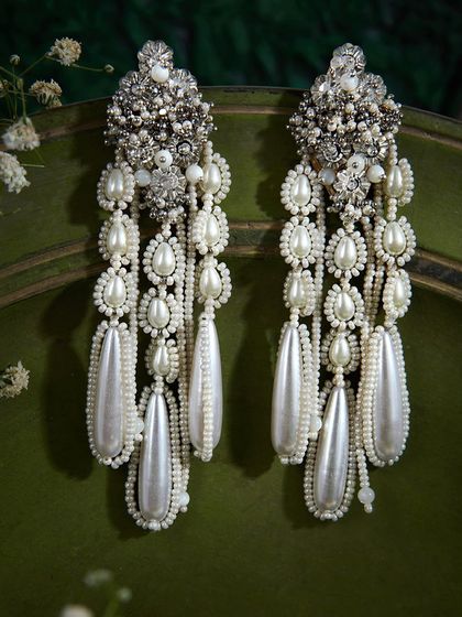 The ultimate statement pearl danglers. These have been a bestseller for their regal and dramatic look.