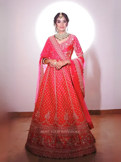 A classic, full-length pose in the pink lehenga. This is the kind of essential shot every makeup artist needs for their bridal portfolio.
