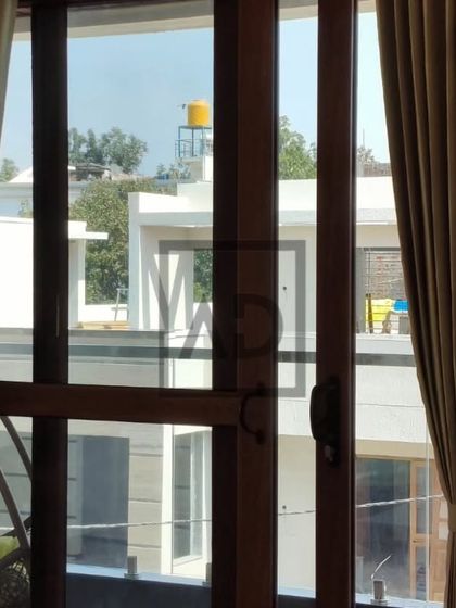 This installation shows how neatly my custom curtains frame a glass door. The tie-backs hold the panels perfectly, ensuring the view is unobstructed while adding a soft, finished look to the room's interior.